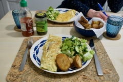 Bean chilli omelette, twice cooked potato and salad